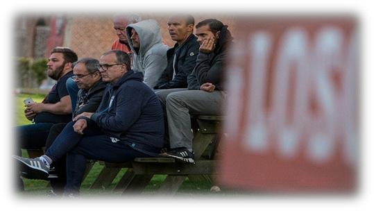 Reda Hammache and staff members on the bench