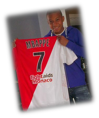 A young Kylian Mbappé wearing a Monaco shirt